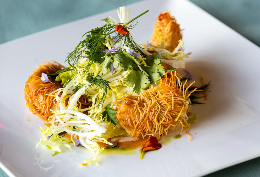 Tiger Shrimp Kaddaif with shredded filo and a citrus-chili glaze from chef Lynn Chia, Tuesday, May 21, 2024, from a pop-up dinner at Pascaline Bakery in Santa Rosa featuring foods from her native Singapore. (John Burgess/The Press Democrat)