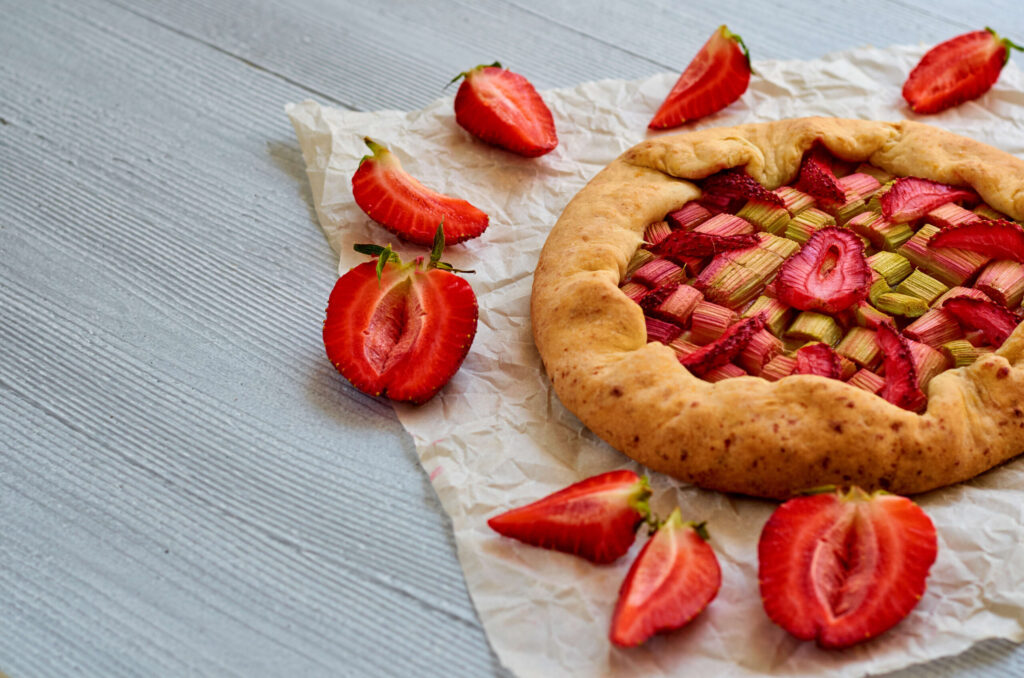 Strawberries and rhubarb are a classic combination, with the rhubarb contributing acidity, which brightens the strawberries. In a buttery, rustic galette, this dessert pairs beautifully with rosé. (OksankaFra / Shutterstock)