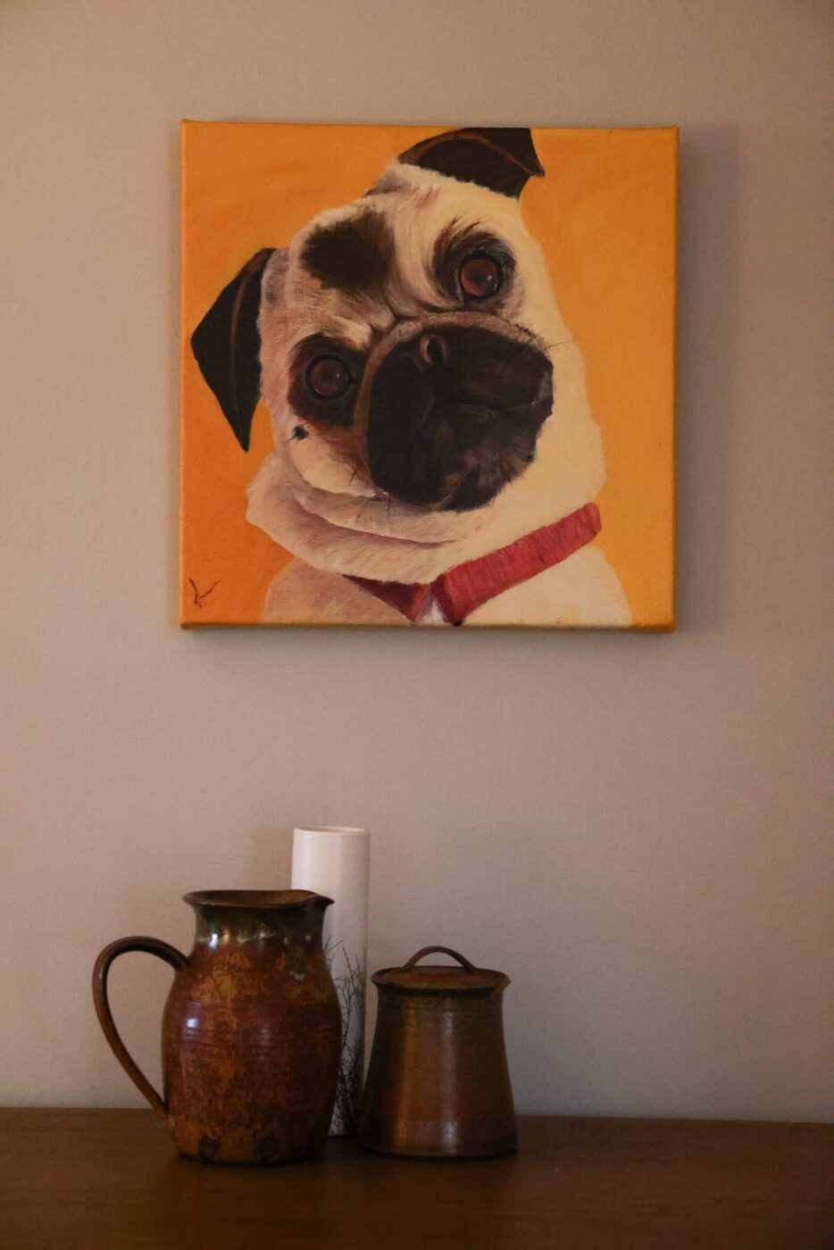 A portrait of Ada Limón’s pug Lily Bean, painted by her mother Stacia Brady, hangs in the hallway of her home in Glen Ellen on Wednesday, February 4, 2026. (Christopher Chung/The Press Democrat)
