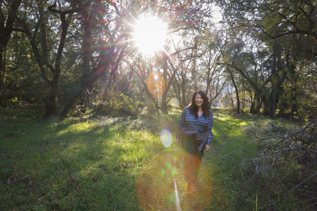 Poet Ada Limón walks towards a creek near her home in Glen Ellen on Wednesday, February 4, 2026. (Christopher Chung/The Press Democrat)