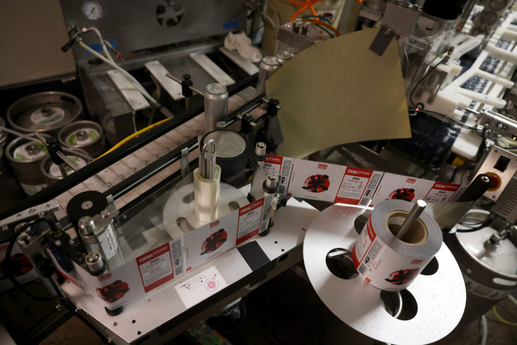 Labels for Mai Japanese Lager run through the canning line at Sonoma Springs Brewing Co. in Sonoma Tuesday, Feb. 3, 2026. (Beth Schlanker / The Press-Democrat)