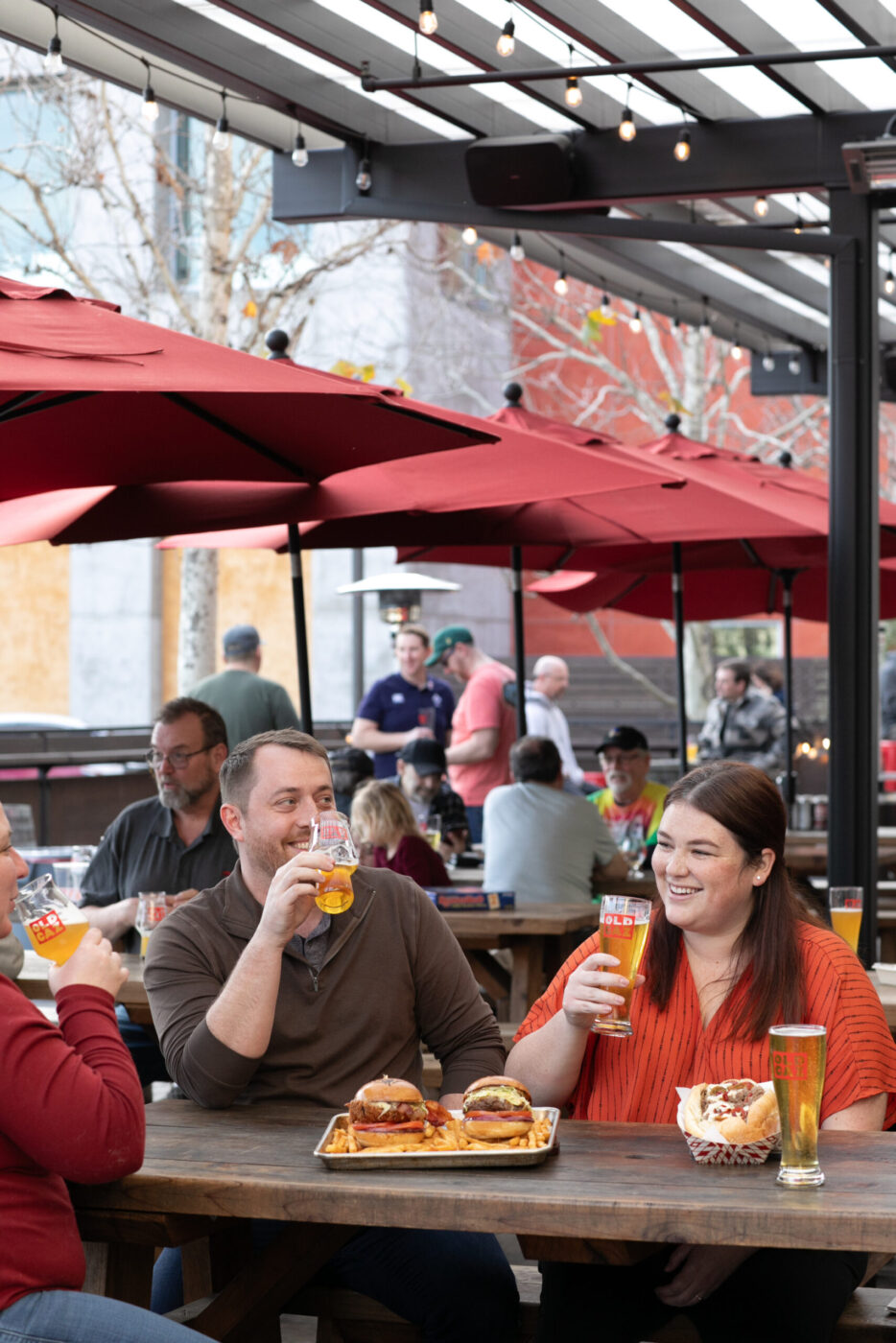 Patrons enjoy an afternoon on the patio at Old Caz Beer in Rohnert Park. (Eileen Roche)