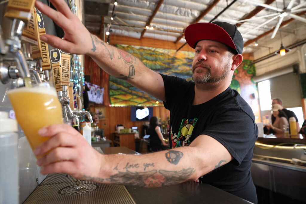 Ian Avery fills a glass of beer for a customer at Cooperage Brewing Company in Santa Rosa on Tuesday, February 3, 2026. (Christopher Chung/The Press Democrat)