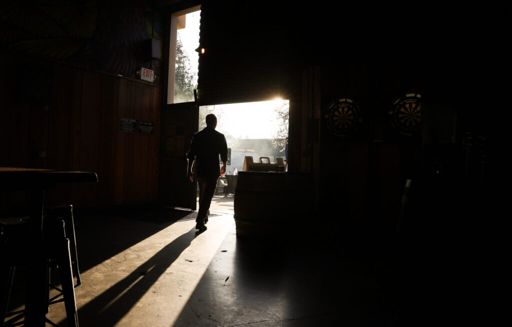 Mason Schelnutt walks to the outdoor patio seating area at Cooperage Brewing Company in Santa Rosa on Tuesday, February 3, 2026. (Christopher Chung/The Press Democrat)