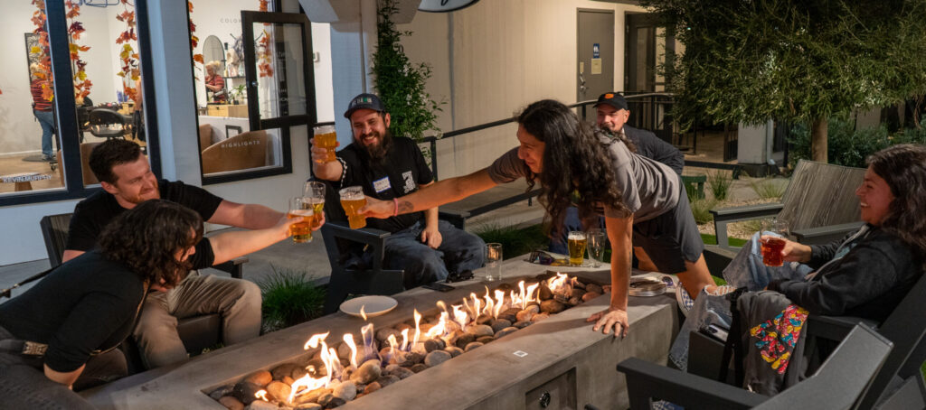 Friends and family of Fieldwork Brewing Co. enjoy one of the three outdoor fire pit tables at the new Montgomery Village location on Friday, Nov. 21, 2025 in Santa Rosa. (Nicholas Vides / For The Press Democrat)