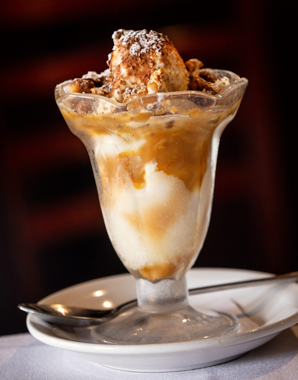 The Caramel Nut Sundae with candied nuts and crushed amaretto cookies from the historic Swiss Hotel Thursday, Feb. 19, 2026 on the square in Sonoma. (John Burgess/The Press Democrat)
