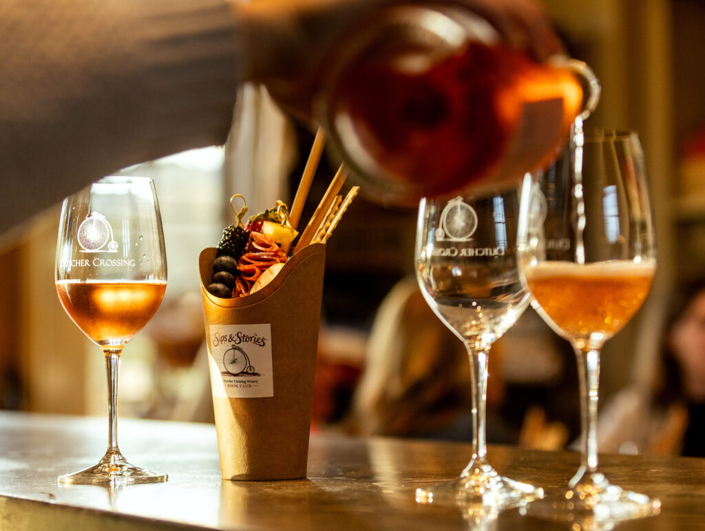 Before sitting down to discuss “The Widow Clicquot,” the Dutcher Crossing Winery Book Club paired the tale of the Grande Dame of Champagne with their Grace Reserve Brut Rose and a charcuterie cup Thursday Feb. 26, 2026 in the Dry Creek Valley. (John Burgess/The Press Democrat)
