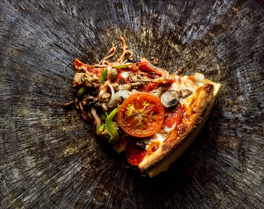 The scratches from over 40 years of pizza cutters leave a work of art on the steel deep dish pans at Old Chicago Pizza Thursday, March 19, 2026 in Petaluma. (John Burgess/The Press Democrat)