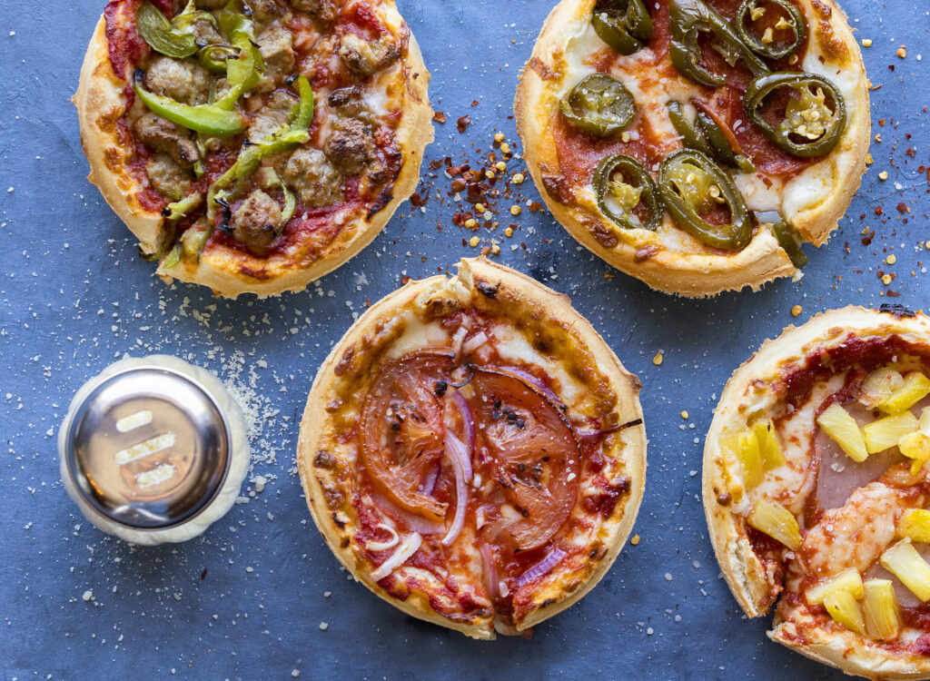 Mini pizzas with a variety of toppings from Old Chicago Pizza in Petaluma. Photo taken Thursday, March 19, 2026. (John Burgess/The Press Democrat)