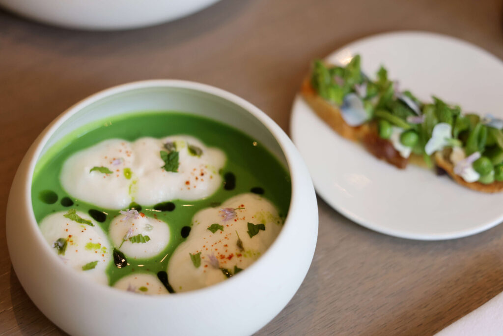 Minted Iacopi Farm Pea Vellutato, a chilled English pea soup with sweet onion clouds and mint toast at Violetto located at the Alila Hotel in St. Helena, Tuesday, July 30, 2024. (Beth Schlanker / The Press Democrat)