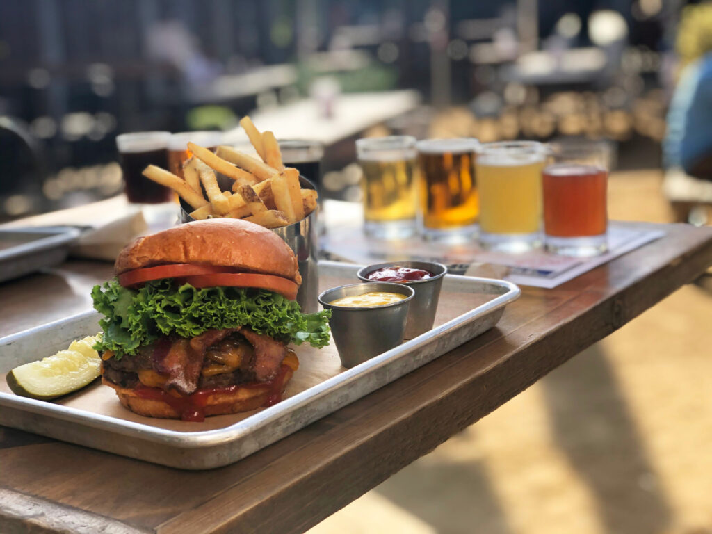 A burger and fries with a flight of beers at Lagunitas in Petaluma. (Sonoma County Tourism)