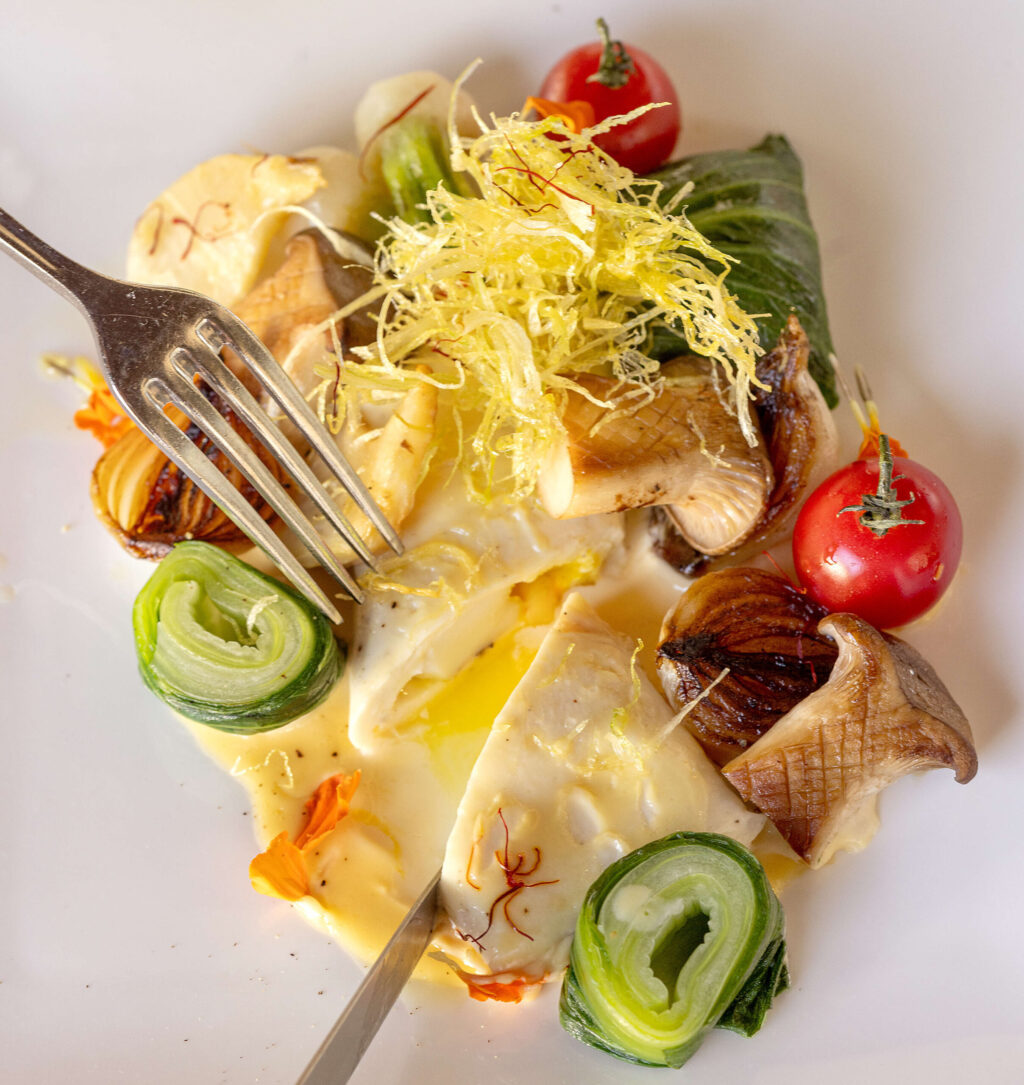 Sole & Scallop Purse with saffron from chef Lynn Chia, Tuesday, May 21, 2024, from a pop-up dinner at Pascaline Bakery in Santa Rosa featuring foods from her native Singapore. (John Burgess/The Press Democrat)