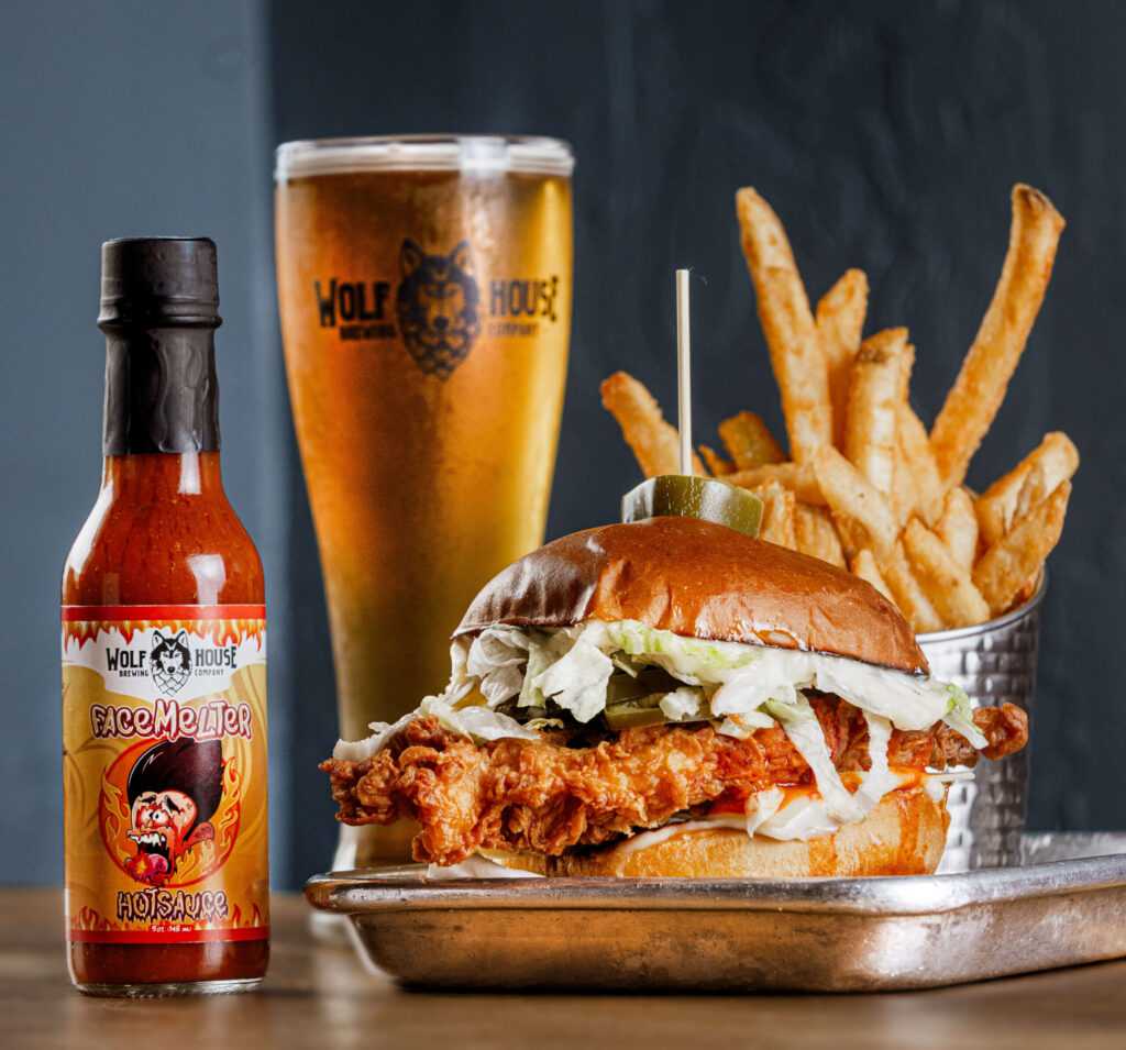 The FaceMelter Chicken Sando with house made hot sauce, pepper jack and pickled jalapeños from Wolf House Brewing Friday, March 28, 2025 in Cloverdale. (John Burgess / Press Democrat)