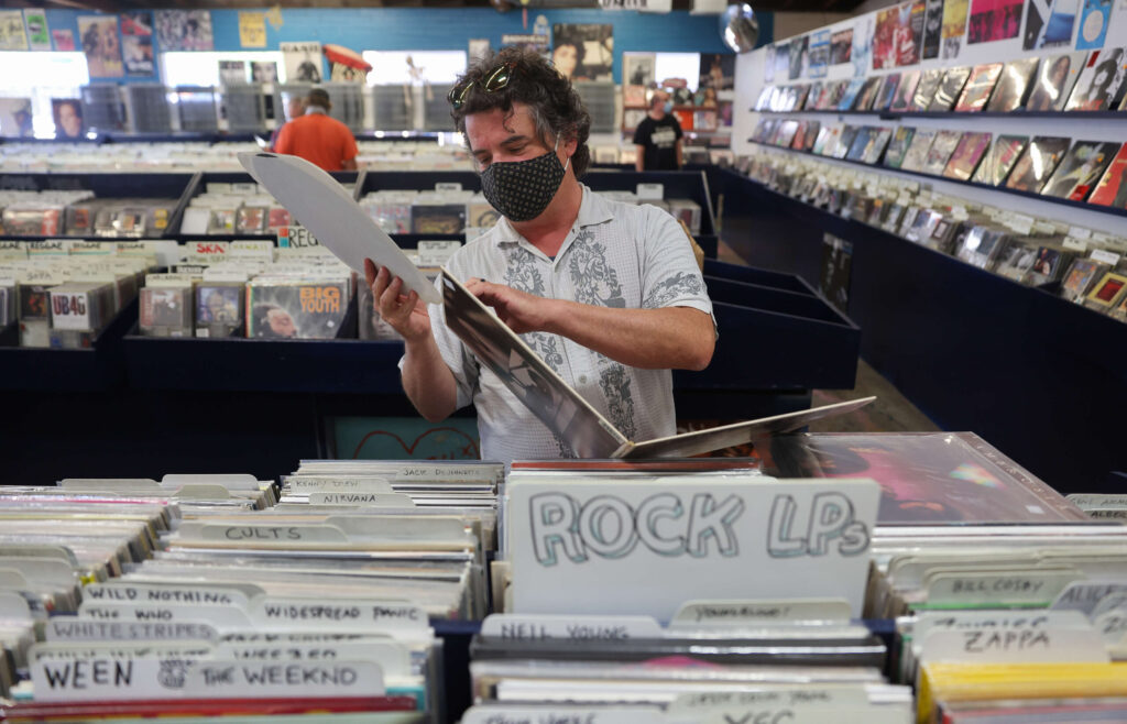 Morris Acevedo checks out a vinyl record at The Next Record Store in Santa Rosa on Tuesday, June 8, 2021. (Christopher Chung / The Press Democrat)