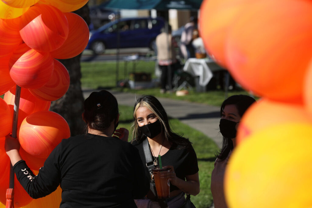 Mercedes Hernandez, owner of Bow N Arrow Clothing, works as the organizer of The Soco Market in Cotati on Sunday, Feb. 21, 2021. (Beth Schlanker/ The Press Democrat)