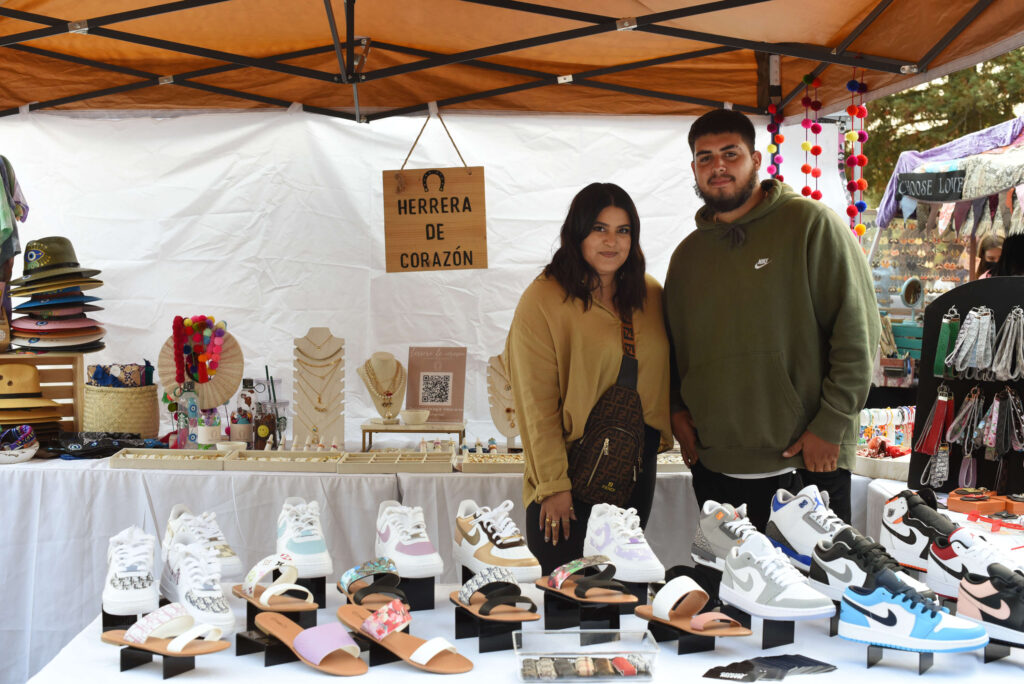 Siblings Lissete Martin, 23, left, owner of Herrera de Corazón, and Miguel Martin 18, owner of Martin Kickzz, at their booth during The SoCo Market held at Old Courthouse Square in downtown Santa Rosa on Friday, Aug. 20, 2021. (Erik Castro/for The Press Democrat)