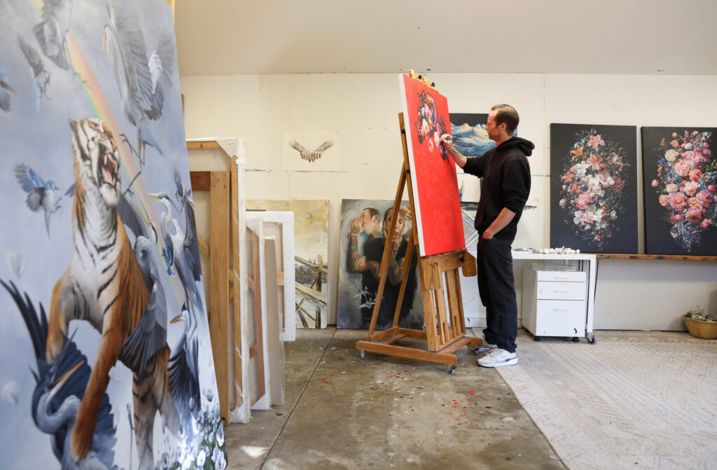 Artist Jake Messing works on a painting, which will be exhibited at the Paul Mahder Gallery, at his studio in Healdsburg on Friday, February 6, 2026. (Christopher Chung/The Press Democrat)