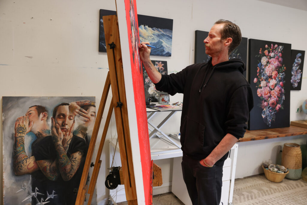 Artist Jake Messing works on a painting, which will be exhibited at the Paul Mahder Gallery, at his studio in Healdsburg on Friday, February 6, 2026. (Christopher Chung/The Press Democrat)
