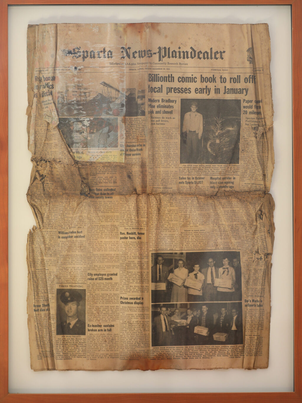 An old newspaper features photos of Jake Messing’s grandfather Roswell Messing, on the left of the group photos in the lower right corner, who operated a printing press. Photo taken in Healdsburg on Friday, February 6, 2026. (Christopher Chung/The Press Democrat)