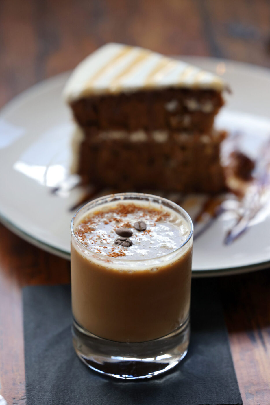 The Canelito cocktail, made with espresso and tequila, and a slice of carrot pineapple cake at Parkside Eats in Santa Rosa Monday, April 13, 2026. (Beth Schlanker / The Press Democrat)