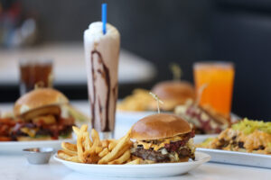 The P & B, made with two beef patties, pastrami, Swiss cheese, sauerkraut, grilled onions, pickles and house-made Pressed sauce, with a side of fries at Pressed in Rohnert Park Friday, April 17, 2026. (Beth Schlanker / The Press Democrat)