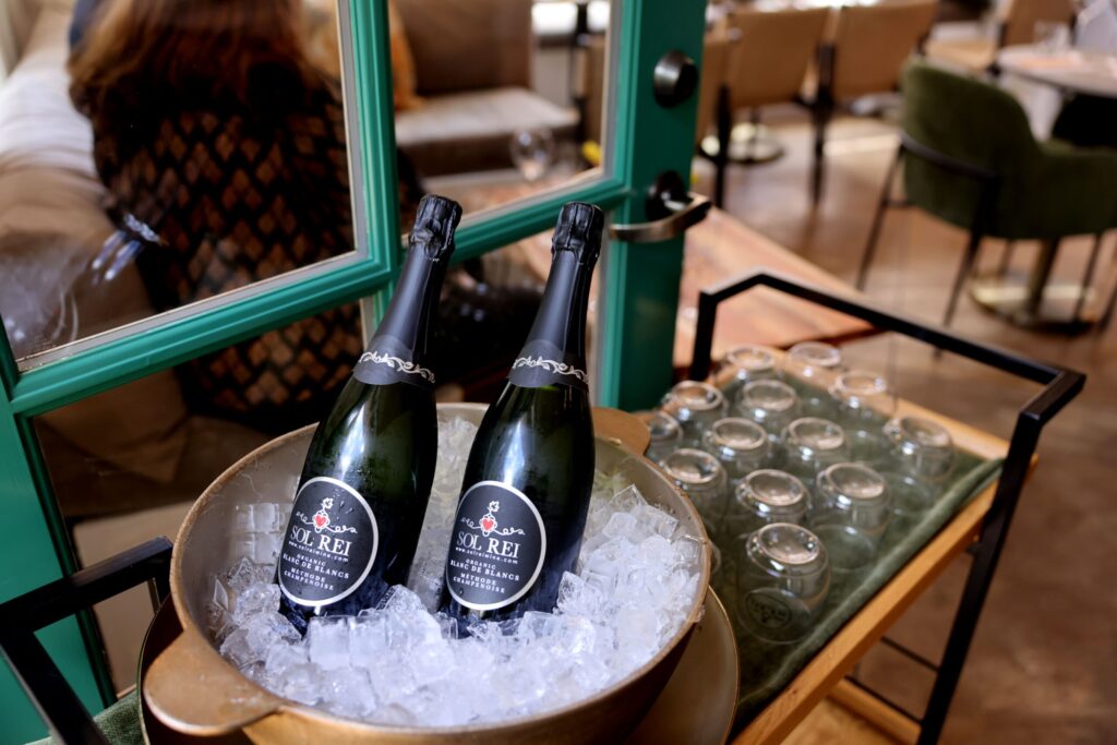Bottles of Blanc de Blancs sparkling wine sit chilled on ice at Sol Rei Wine tasting room in Sonoma Thursday, April 23, 2026. (Beth Schlanker / The Press Democrat)
