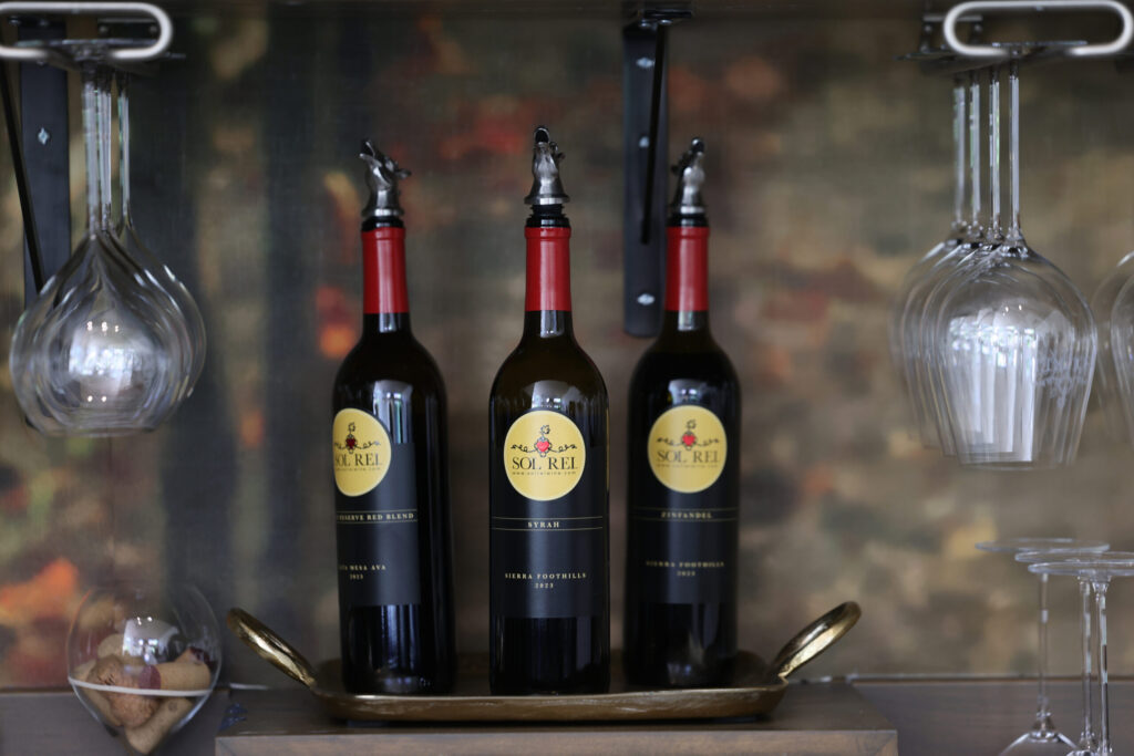 Bottles of 2023 Private Reserve Red Blend, Syrah, and Zinfandel at Sol Rei Wine tasting room in Sonoma Thursday, April 23, 2026. (Beth Schlanker / The Press Democrat)