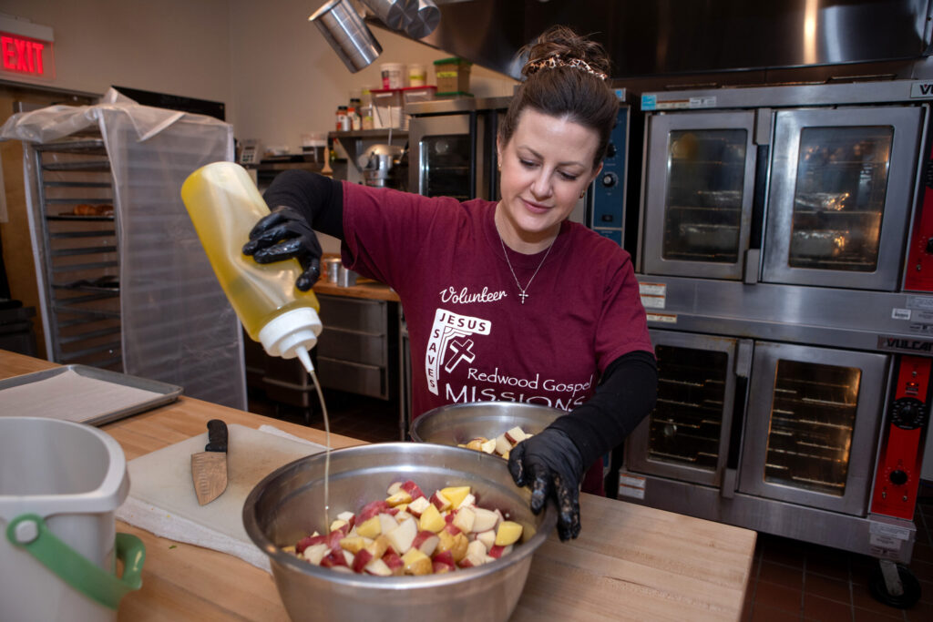 Volunteer, Robin Pistorio of Santa Rosa, makes potato salad in the kitchen at the new Redwood Gospel Baking Company cafe in Santa Rosa, Friday, April 10, 2026. (Darryl Bush/For The Press Democrat)