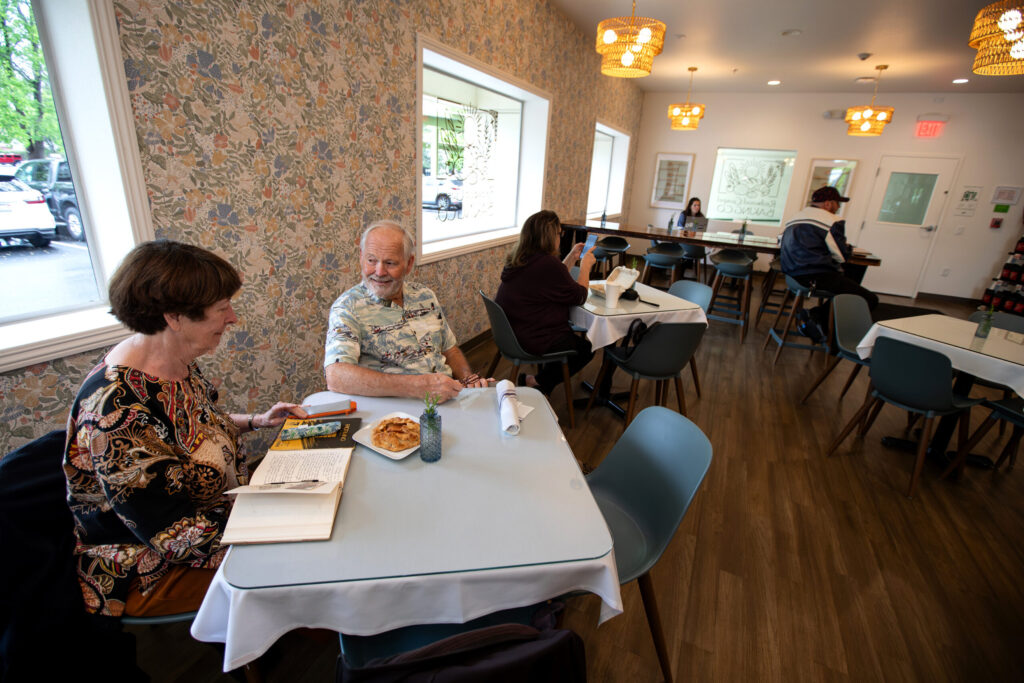 Customers, Chris and Archie Cates of Santa Rosa, dine at the new Redwood Gospel Baking Company cafe in Santa Rosa, Friday, April 10, 2026. (Darryl Bush/For The Press Democrat)