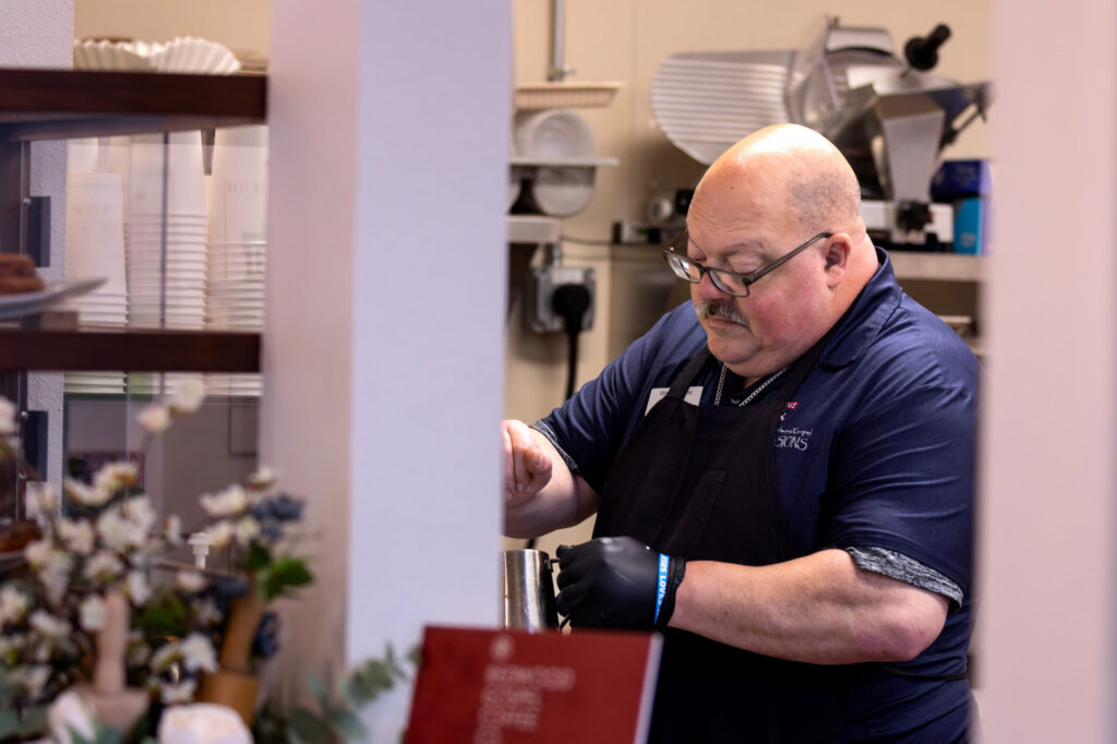 Barista, Wayne Murray of Santa Rosa, who completed training through Redwood Gospel Mission’s program, prepares coffee for customers at the new Redwood Gospel Baking Company cafe in Santa Rosa, Friday, April 10, 2026. (Darryl Bush/For The Press Democrat)