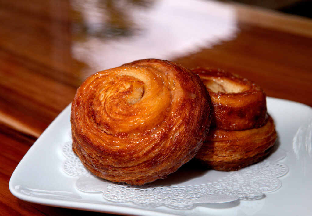 Two kouign amann pastries are served at the new Redwood Gospel Baking Company cafe in Santa Rosa, Friday, April 10, 2026. (Darryl Bush/For The Press Democrat)