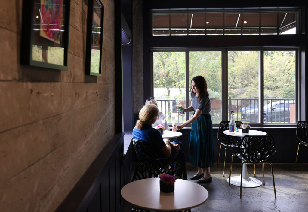 Owner Lindsey Blanchard pours a glass of wine for guests at Wolves Lovers + Thieves in Glen Ellen on Friday, March 13, 2026. (Christopher Chung/The Press Democrat)