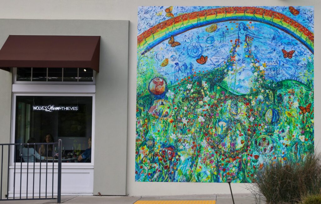 A mural by artist Maria de Los Angeles on the building that houses the Wolves Lovers + Thieves tasting room, inspired the owners to use her artwork for their wine label. Photo taken in Glen Ellen on Friday, March 13, 2026. (Christopher Chung/The Press Democrat)