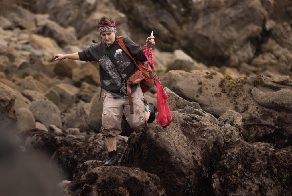 Fork in the Path instructor Ryn Sullivan heads to the beach with a bag of harvested purple urchins Jan. 18, 2026 at the Sand Beach Cove at Fort Ross State Historic Park on the Sonoma Coast. (John Burgess / The Press Democrat)