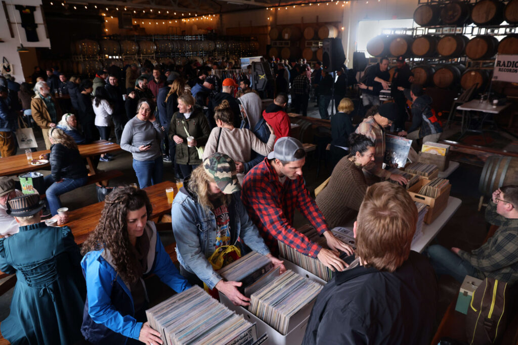 People attend the Sonoma County Record Show, organized in partnership with RadioThrift and The NorCal Vinyl Society, at Shady Oak Barrel House in Santa Rosa, Sunday, March 19, 2023. (Beth Schlanker/The Press Democrat)