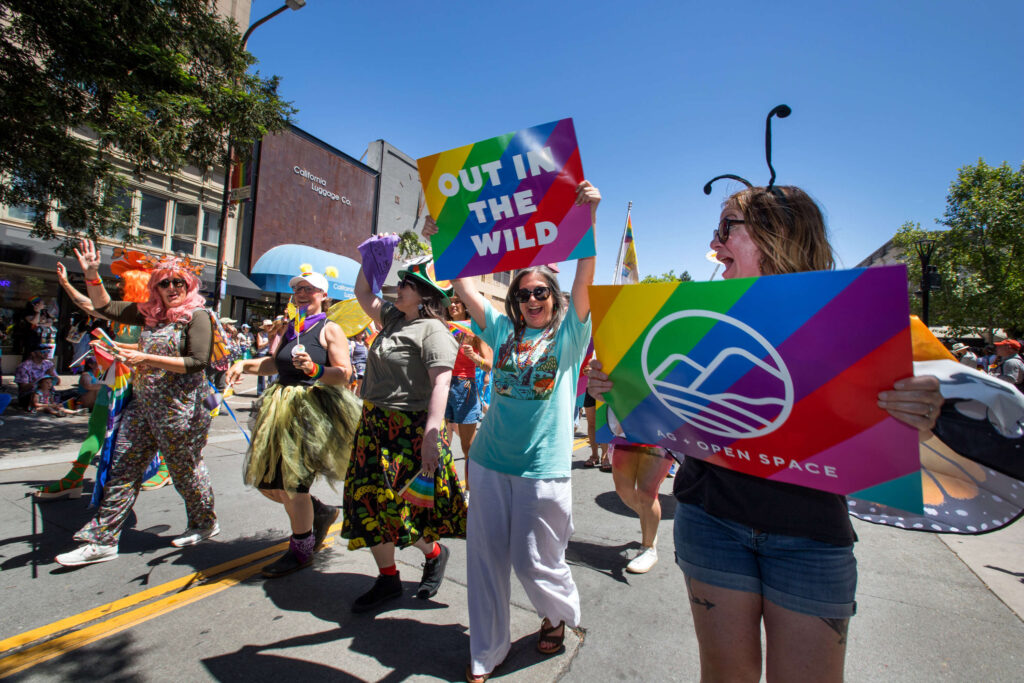 Sonoma County's AG and Open Space participants march on hold signs during the 2025 Sonoma County Pride Parade in Santa Rosa on Saturday, May 31, 2025. (Darryl Bush / For The Press Democrat)