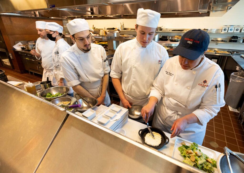 Students Santa Rosa Junior College culinary program students put their lessons to the test on Thursday during lunch service at the Café Rose April 20, 2023. (John Burgess/The Press Democrat)