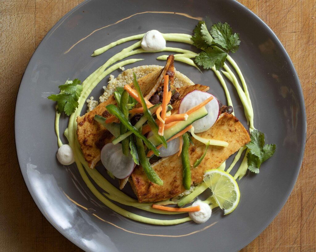 Black Bean and Sweet Potato Enchilada with hand-pressed tortillas, avocado and cashew crema from the Santa Rosa Junior College's Culinary Cafe. (John Burgess/The Press Democrat)