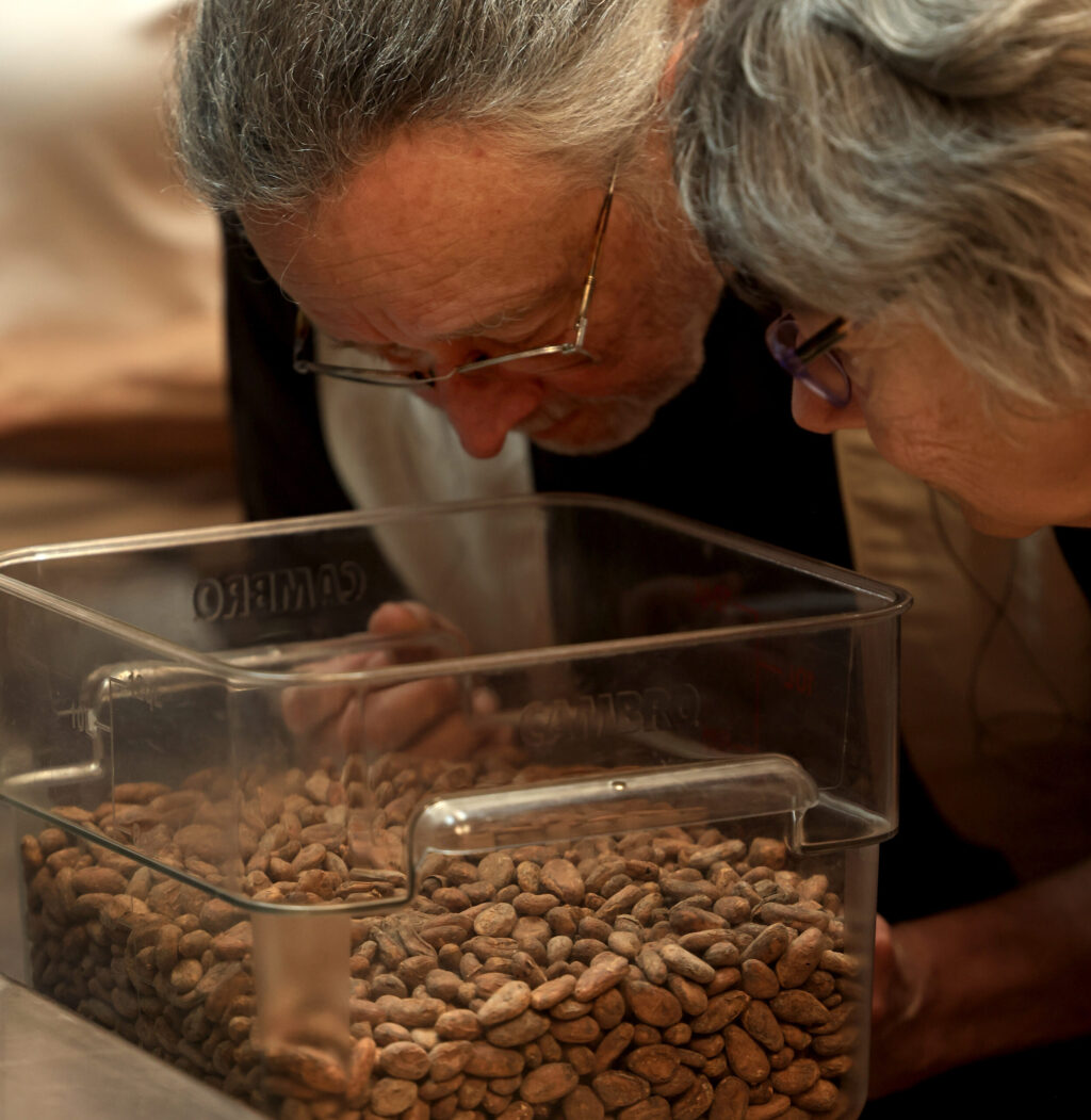 Visitors to Rainy Day Chocolate in Forestville, Sunday, March 29, 2026, take in the aroma of fresh cacao. (Kent Porter / The Press Democrat)
