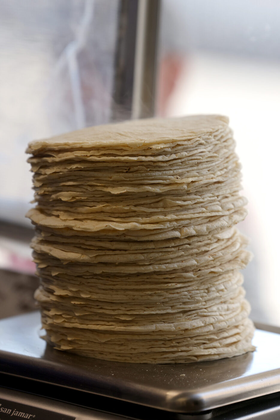 A stack of freshly made tortillas at Tortilleria Apatzingan in Santa Rosa Tuesday, July 8, 2025. (Beth Schlanker / The Press Democrat)