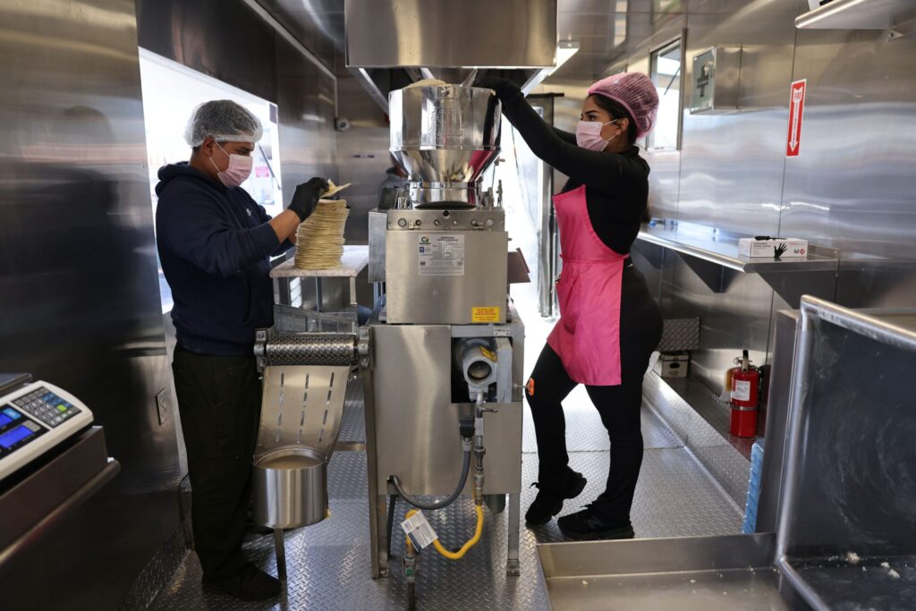Employees Jesus Mandonado, left, and Mia Espinoza make fresh tortillas at Tortilleria Mexico Mi Amor in Napa Thursday, Feb. 5, 2026. (Beth Schlanker / The Press Democrat)