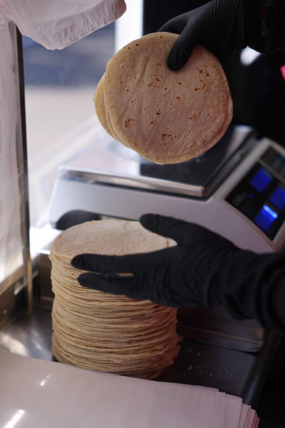 Employee Mia Espinoza wraps up freshly made tortillas at Tortilleria Mexico Mi Amor in Napa Thursday, Feb. 5, 2026. (Beth Schlanker / The Press Democrat)