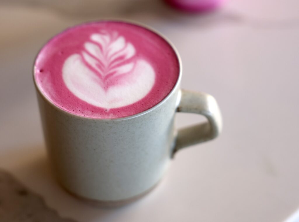 The Pink Squirrel latte made with beet root powder at the Grey Squirrel Manor in Windsor Sunday, March 15, 2026. (Beth Schlanker / The Press Democrat)