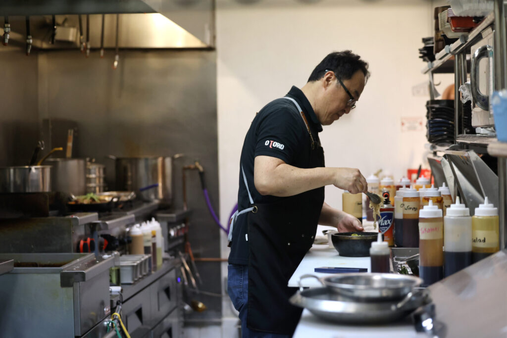 Chef and owner Albert Park works in the kitchen at Seoul to Tokyo restaurant in Santa Rosa Monday, May 4, 2026. (Beth Schlanker / The Press Democrat)