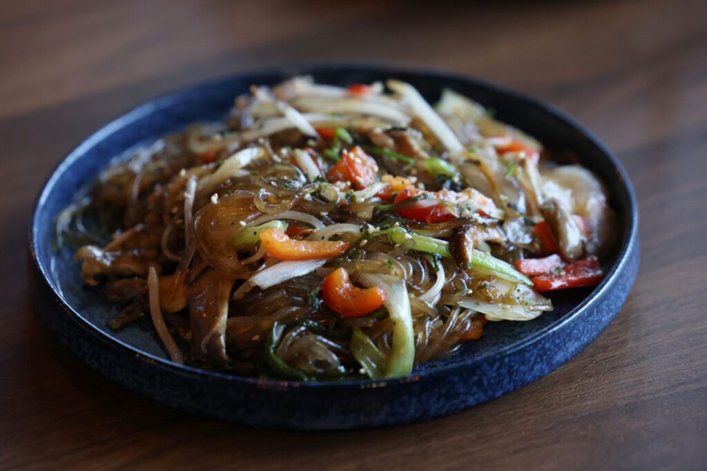 Japchae, stir-fried glass noodles with vegetables, at Seoul to Tokyo restaurant in Santa Rosa Monday, May 4, 2026. (Beth Schlanker / The Press Democrat)