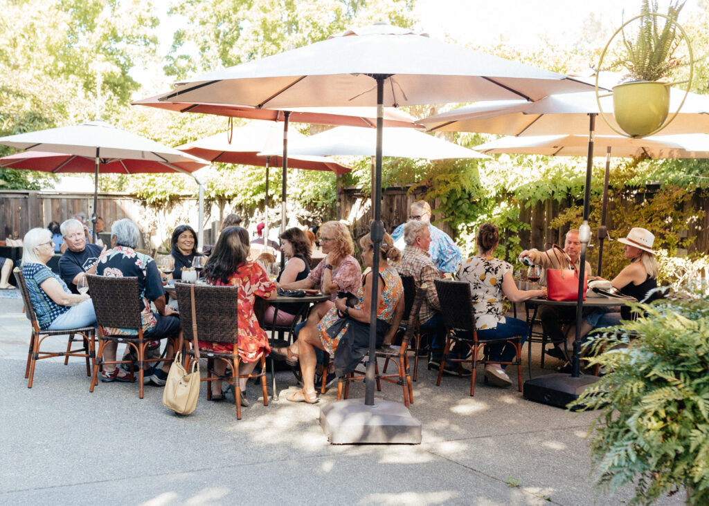 At Dutton-Goldfield Winery in Sebastopol, happy hour events reflect a deliberate shift toward more social experiences. On the third Thursday of each month, the winery invites walk-in visitors to enjoy discounted wines by the glass and bottle service. Small bites are free. (Courtesy of Dutton-Goldfield Winery)
