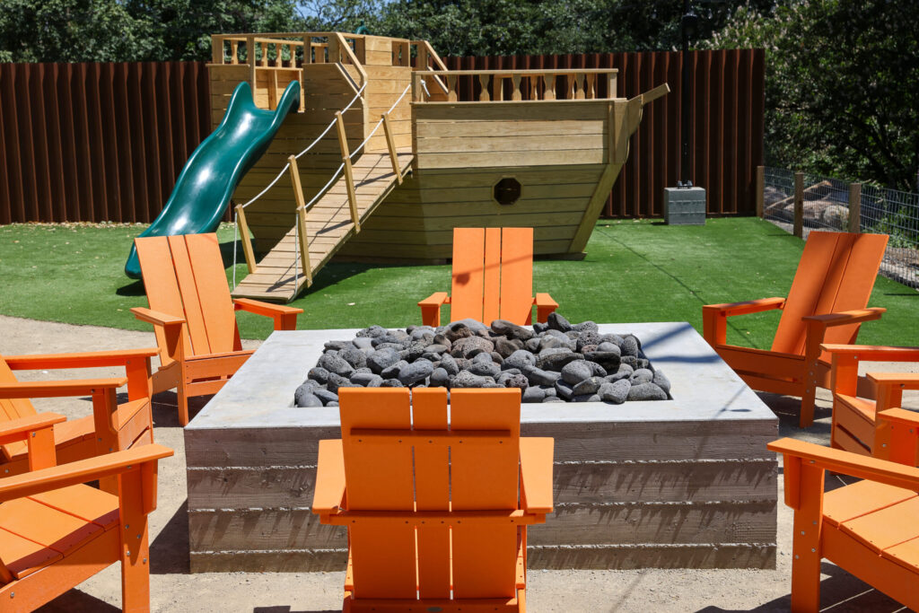 A fire pit and children’s ship play structure at The Junction in Santa Rosa on Monday, May 18, 2026. (Christopher Chung/The Press Democrat)