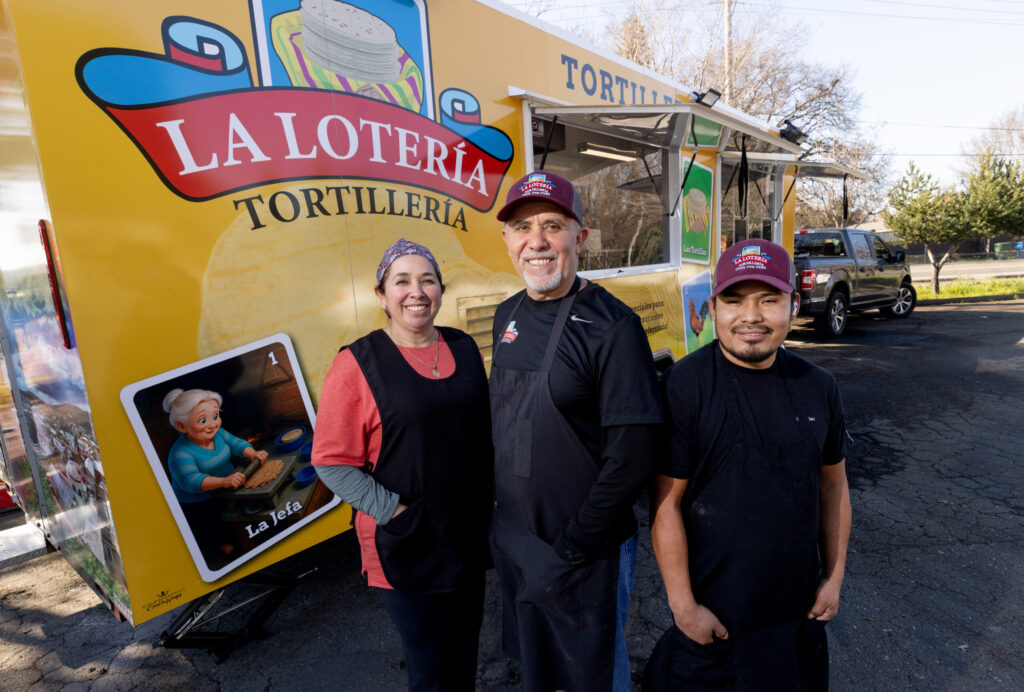 From left, Lucrecia and Ramiro Garcia with Gregorio Chavez in front of the Tortilleria La Loteria fresh tortilla factory food truck on Stony Point Road in Santa Rosa. (John Burgess / The Press Democrat)