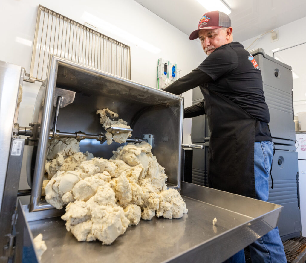 Ramiro Garcia unloads dough from the mixer Friday, Jan. 16, 2026 inside the Tortilleria La Loteria fresh tortilla factory food truck on Stony Point Road in Santa Rosa. (John Burgess / The Press Democrat)