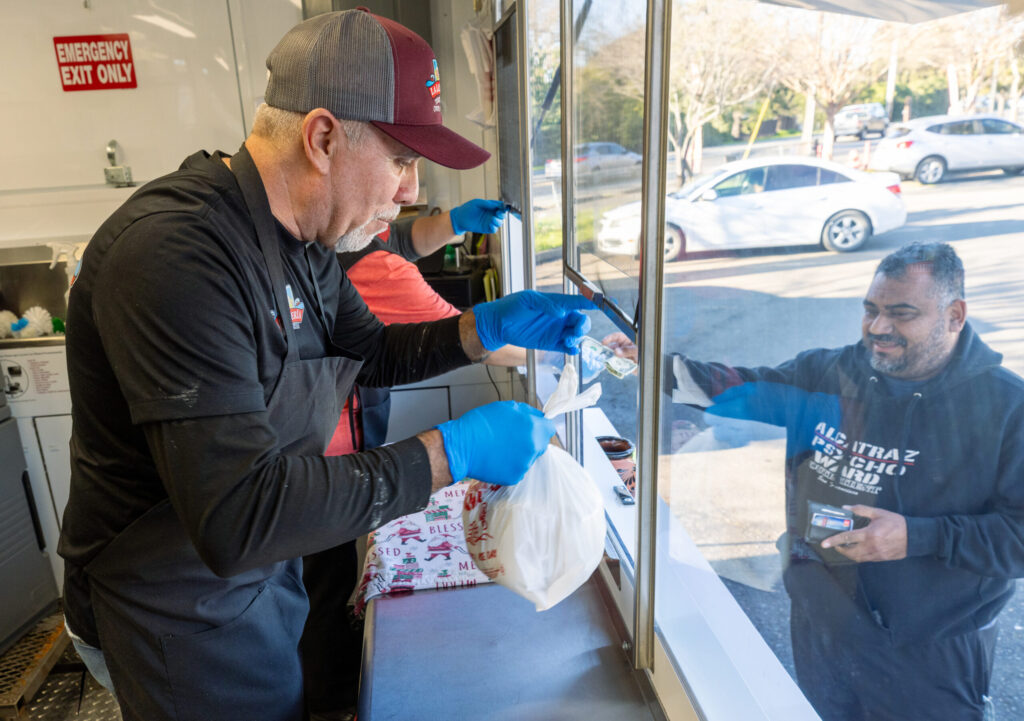 Ramiro Garcia sells fresh corn tortillas by the pound Friday, Jan. 16, 2026 from his Tortilleria La Loteria tortilla factory food truck on Stony Point Road in Santa Rosa. (John Burgess / The Press Democrat)
